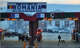  ?? DANIEL MIHAILESCU/AFP/GETTY IMAGES ?? When crossing the Romanian border with Hungary, Viktor Talic’s boss uses friendly greetings — and bribes — to move on.