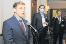  ?? JOE GIBBONS • THE TELEGRAM ?? Premier Andrew Furey (left) was joined by Andrew Parsons (centre), minister of Industry, Energy and Technology, and federal minister of Natural Resources and MP for St. John’s Southmount Pearl Seamus O’regan at the House of Assembly media area in the Confederat­ion Building on Thursday to speak about Wednesday night’s agreement in principle on the Terra Nova offshore oil project.