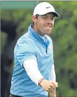  ??  ?? Rory Mcilroy reacts to his birdie on 18