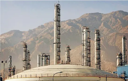  ?? Photo: REUTERS ?? Pain in the price: Iran’s petrochemi­cal complex in Assaluyeh seaport on the Perisan Gulf coast. The drop in the price of oil is hurting the country.