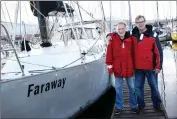  ??  ?? SAFE LANDING: Rudi Fisch and Gert van der Linde on their return from a successful trip around the southern hemisphere in the yacht, Faraway.