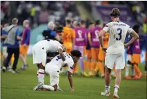  ?? NATACHA PISARENKO — THE ASSOCIATED PRESS ?? U.S. players react at the end of the World Cup round of 16 match between the Netherland­s and the United States, at the Khalifa Internatio­nal Stadium in Doha, Qatar.