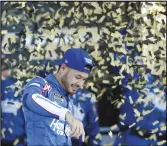  ?? Associated Press ?? Kyle Larson reacts in Victory Lane after winning a NASCAR Cup Series playoff race on Sunday at Kansas Speedway in Kansas City, Kan. The win came on the anniversar­y of the Hendrick plane crash.