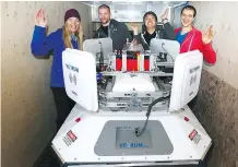  ??  ?? From left, Kristy Dixon, Zac Trolley, Maxwell Lee and Adam Bhavnani with their oilsands robot Francecsha.