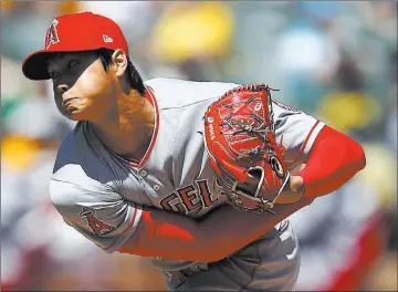  ?? Ben Margot ?? The Associated Press Angels pitcher Shohei Ohtani, shown in the second inning, allowed three runs on three hits with six strikeouts in a 7-4 victory Sunday over the Athletics in Oakland, Calif.