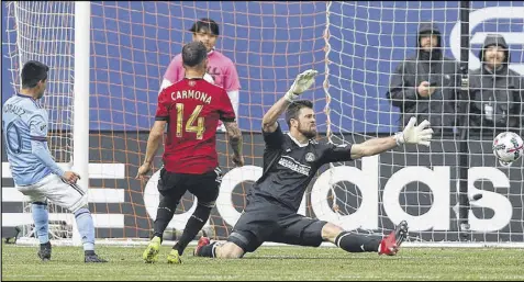  ?? PHOTOS BY KATHY WILLENS / ASSOCIATED PRESS ?? Midfielder Maxi Moralez (far left) drives a shot past Atlanta United goalkeeper Alec Kann in the second half, giving NYCFC a 3-1 lead. Atlanta United’s Carlos Carmona is unable to stop the play.