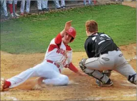  ?? THOMAS NASH — DIGITAL FIRST MEDIA ?? Owen J. Roberts’ Ben Karpinski (23) slides in safe ahead of the tag from Boyertown’s Broc Babb on Jordan Siket’s triple during the bottom of the third inning Friday. Owen J. Roberts won 13-3 in six innings.