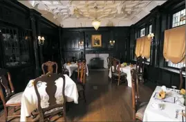  ?? Nate Guidry/Post-Gazette photos ?? A view of the dining room inside the grand hall at the Mansions on Fifth Hotel in Shadyside, pictured at top.