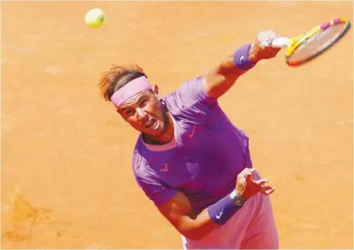  ?? Reuters ?? ↑
Rafael Nadal returns a shot to Denis Shapovalov (unseen) during their Italian Open match in Rome on Thursday.