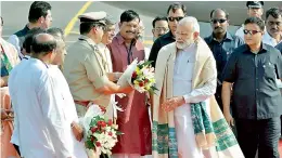  ?? PTI ?? Prime Minister Narendra Modi being welcomed by party leaders upon his arrival at Biju Patnaik Airport, in Bhubaneswa­r on Saturday. —