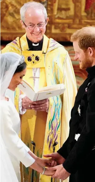  ??  ?? Personal bond: Archbishop Welby marries Harry and Meghan in 2018