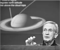  ?? — AFP photo ?? Maize speaks at an end of mission preview news briefing for Cassini mission to Saturn.