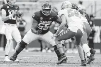  ?? Sam Craft / Associated Press ?? Kenyon Green (55) is expected back at right tackle for A&M against Arkansas after playing right guard against New Mexico.