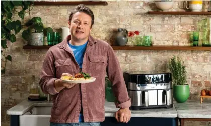  ?? Photograph: Chris Terry ?? Are we really here, still? … Jamie Oliver with a prosciutto baked fish dish cooked in his air fryer.