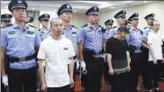  ?? PROVIDED TO CHINA DAILY ?? Zhang Wuya (left) and five accomplice­s stand trial at Haidian District People’s Court in Beijing on Tuesday for using high-tech equipment to provide answers to 33 students during the national exam for graduate schools.