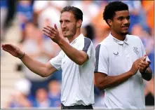  ?? ?? Ben Davies and Malik Tillman are presented to the Ibrox fans