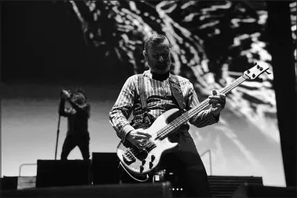  ?? AL POWERS FOR T-MOBILE ARENA ?? Bassist Justin Chancellor, foreground, plays as Maynard James Keenan sings Sunday during Tool’s concert at T-mobile Arena. The Las Vegas show was the last stop on the “Tool Winter Tour 2024.”