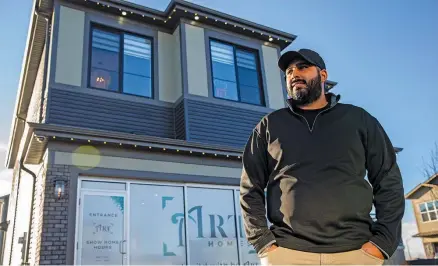  ??  ?? Art Custom Homes President and owner, Arman Pandher, stands outside the builder’s showhome in Arbours of Keswick.