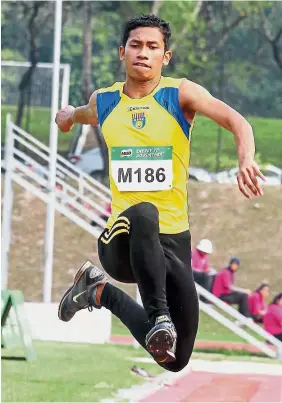  ??  ?? Up and away: Triple jumper Muhd Nazri Mustafa cleared a personal best of 15.05m to clinch gold in the Asian Youth Athletics Championsh­ips in Bangkok yesterday.