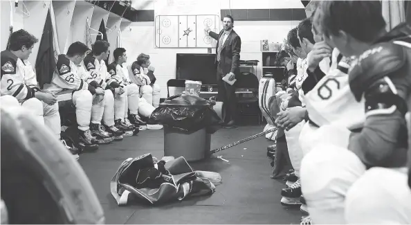  ?? GAVIN YOUNG / POSTMEDIA NEWS ?? Humboldt Broncos head coach Nathan Oystrick talks to his team before an exhibition game in Peace River, Alta., on Sunday, their second after the tragic bus crash on April 6.