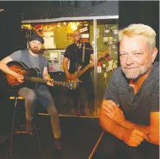  ?? DARREN MAKOWICHUK/FILES ?? Ironwood Stage and Grill Owner Patrick Mcintyre was with The Black Belts Aaron Young and Jory Kinjo June 16 to try out his new Plexiglas booth for live music.