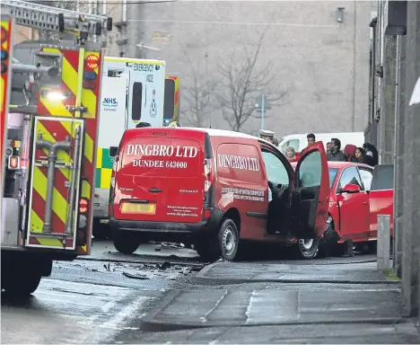  ??  ?? EMERGENCY crews were called out to a Dundee street following a collision between a van and a car.
Police and fire crews attended the incident, which took place at the junction of Dundonald Street and Ogilvie Street just after 8.30am today.
Two...