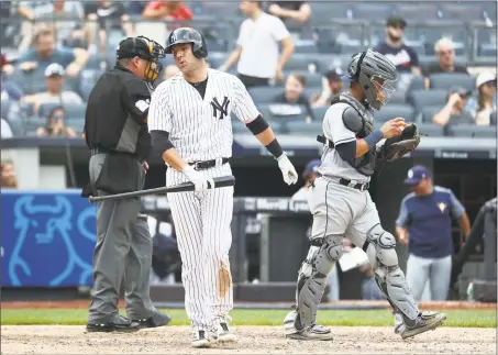  ?? Al Bello / Getty Images ?? The Yankees’ Austin Romine strikes out with the bases loaded to end the game in a 3-1 loss against the Tampa Bay Rays at Yankee Stadium on Thursday.