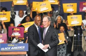  ?? David J. Phillip / Associated Press ?? Houston Mayor Sylvester Turner (left) introduces Democratic presidenti­al candidate Mike Bloomberg at a campaign event Thursday in the Buffalo Soldiers National Museum.