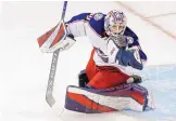  ?? KATHY WILLENS/ASSOCIATED PRESS ?? Columbus Blue Jackets goaltender Matiss Kivlenieks has the puck in his hand as he makes a save during the third period against the New York Rangers on Jan. 19, 2020.