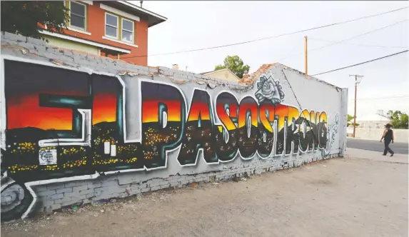  ?? MARIO TAMA/GETTY IMAGES ?? An El Paso Strong mural is one sign of a community working through the healing process following the mass shooting Aug. 3 which killed 22 people.