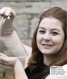  ??  ?? Award Nicola Gaffney with her modern apprentice of the year trophy