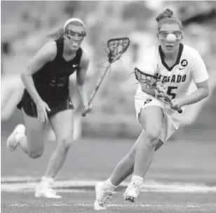  ?? Jeremy Papasso, Daily Camera ?? Colorado’s Darby Kiernan chases down the ball during the Pac-12 women’s lacrosse championsh­ip game against Stanford on Sunday in Boulder.