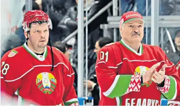  ?? ?? Alexander Lukashenko, right, found time to play in an ice hockey match in Minsk yesterday as his country’s migrant crisis intensifie­d