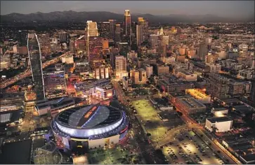  ?? Wally Skalij Los Angeles Times ?? AN AERIAL view of the downtown Los Angeles skyline with Staples Center. The multipurpo­se venue will soon be called Crypto.com Arena, after naming rights went for a reported bid exceeding $700 million.