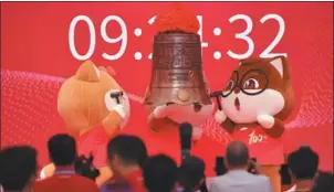  ?? CHEN WEN / CHINA NEWS SERVICE ?? Mascots of Three Squirrels, a mainland-based food and snack company, perform at the firm’s listing ceremony in Shenzhen, Guangdong province.
