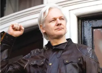  ?? AP ?? Julian Assange greets supporters outside the Ecuadorian embassy in London, on May 19, 2017.