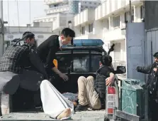  ?? Reuters ?? An injured person is taken to hospital after the Kabul attack. ISIS said its fighters targeted the ceremony