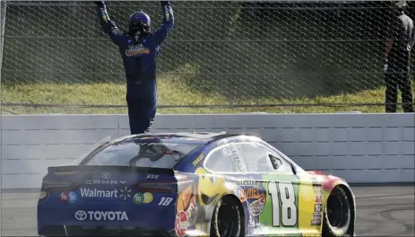  ?? PHOTO/DERIK HAMILTON ?? AP Kyle Busch celebrates after winning a NASCAR Cup Series auto race, on Sunday, in Long Pond, Pa.