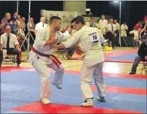  ??  ?? Darryl in action against Rob Salvi from England at the British Open Knockdown Karate tournament.