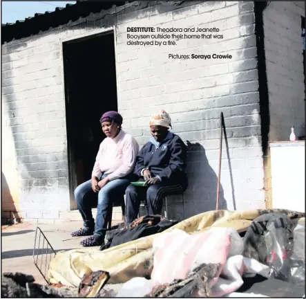  ??  ?? DESTITUTE: Theodora and Jeanette Booysen outside their home that was destroyed by a fire.
Pictures: Soraya Crowie