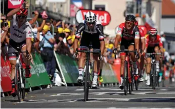  ?? Christian Hartmann / Reuters ?? Trek-Segafredo rider John Degenkolb, left, accused Team Sunweb’s Michael Matthews, centre, of straying from his line in the sprint towards the finish on Stage 16