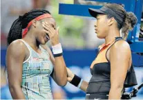  ??  ?? Agony and empathy: Naomi Osaka (right) comforts Coco Gauff