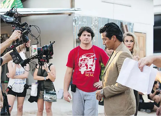  ?? UNVEIL STUDIOS. ?? Director Daniel Kooman, centre, wants She Has A Name to be a catalyst for ending human traffickin­g. Here, he discusses a scene with actor Will Yun Lee.