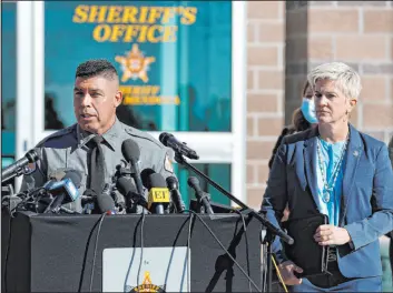  ?? Andres Leighton The Associated Press ?? Santa Fe County Sheriff Adan Mendoza, left, speaks as Santa Fe District Attorney
Mary Carmack-altwies listens during a news conference Wednesday in Santa Fe, N.M.