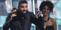  ?? Matt Sayles/Invision/AP ?? Drake accepts the award for best rap song for “God’s Plan” at the Grammy Awards on Sunday.