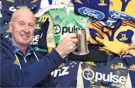  ?? PHOTO: PETER MCINTOSH ?? Take your pick . . . Former Highlander­s baggage man Neville Ives with some of the jerseys he has dealt with over the years.