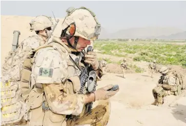  ?? SGT. DAREN KRAUS/IMAGE TECH ?? Sgt. John Martin, left, and Lieut. Steve Keeble, foreground, on patrol in the Panjwaii district in 2010. ‘The enemy is on its knees here now,’ said a top Afghan commander. ‘The truth of it is that it is because of the hard work of the Canadians.’