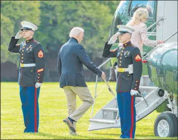  ?? Manuel Balce Ceneta The Associated Press ?? President Joe Biden and first lady Jill Biden board Marine One on Saturday as they leave Fort Lesley J. Mcnair in Washington to spend the weekend at their Delaware home.