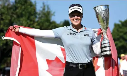  ?? ?? Brooke Henderson with the Evian Championsh­ip trophy after her victory in France. Photograph: Stuart Franklin/Getty Images