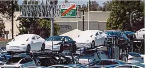  ?? BLOOMBERG PIC ?? Tesla Inc has finally exceeded a long-sought target after producing 5,000 units of Model 3s in one week.